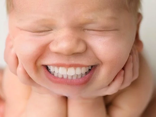 smiling babies with teeth